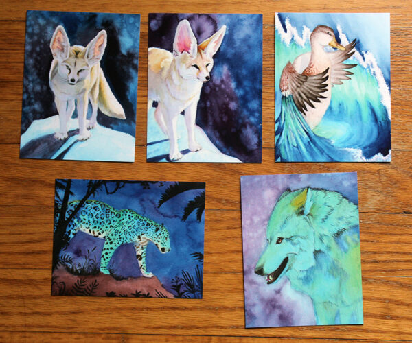 A set of 5 watercolor postcard prints featuring wolves, foxes, a jaguar and a duck.